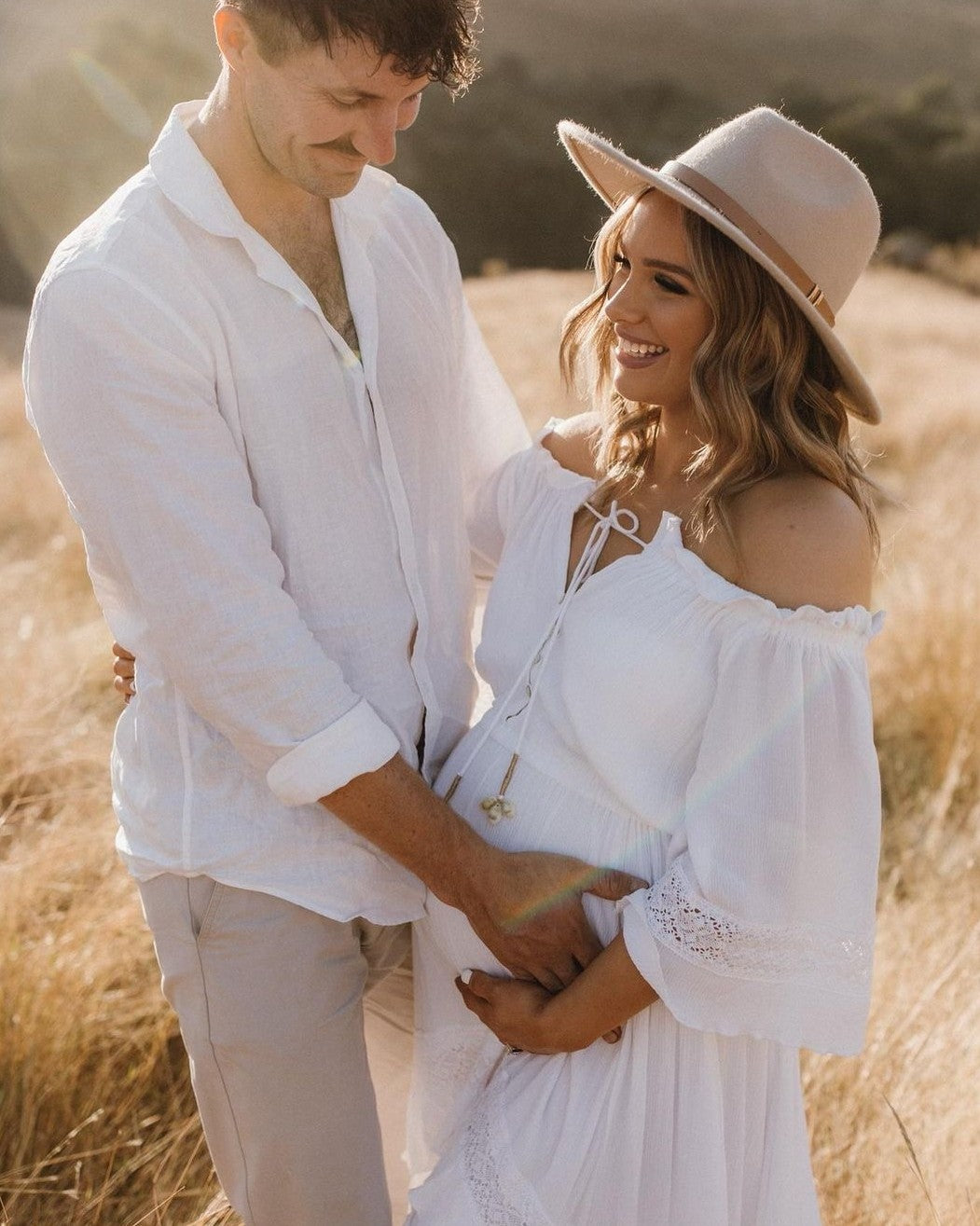 White flowy maternity dress perfect for photoshoots