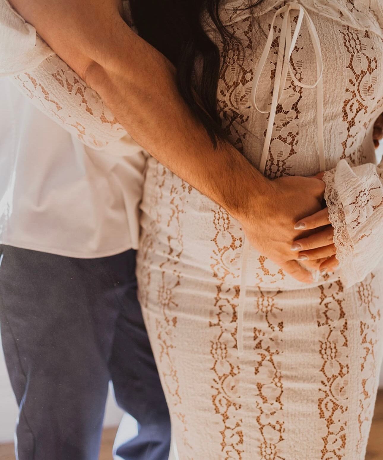 A pregnant lady during her baby shower wearing Everything Lace Hire House of CB Belle Vintage lace Maxi Dress.