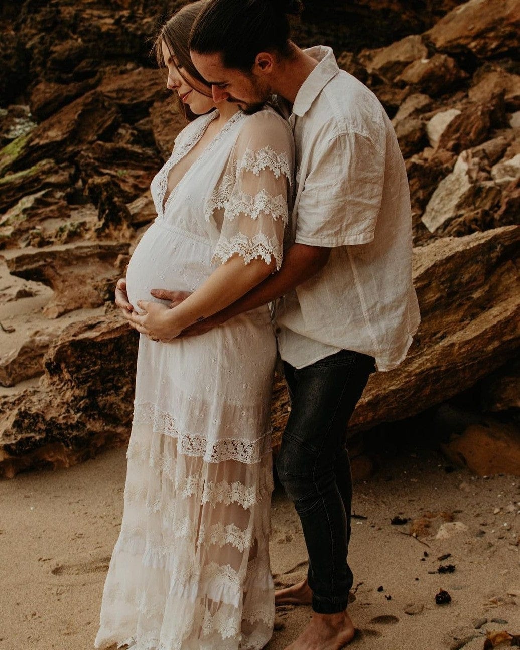 Mum wearing a lace maternity dress from Everything Lace Hire