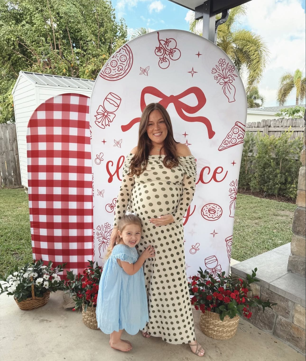 Pregnant lady wearing Everything ace Hire AFRM Thelma Green Dot Baby Shower Dress