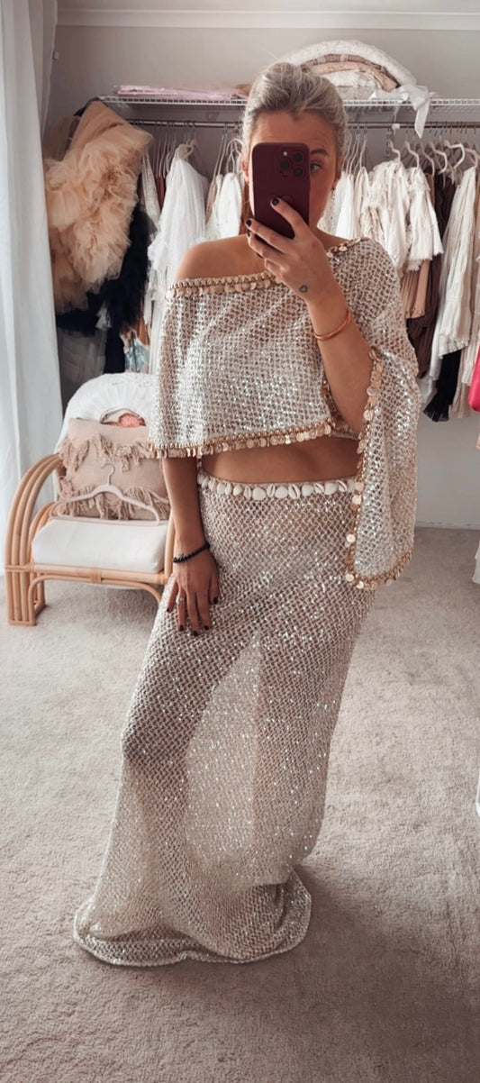 wearing a maternity photoshoot two piece set from Everything Lace Hire featuring a knit sequin fabric and embellished shell detailing