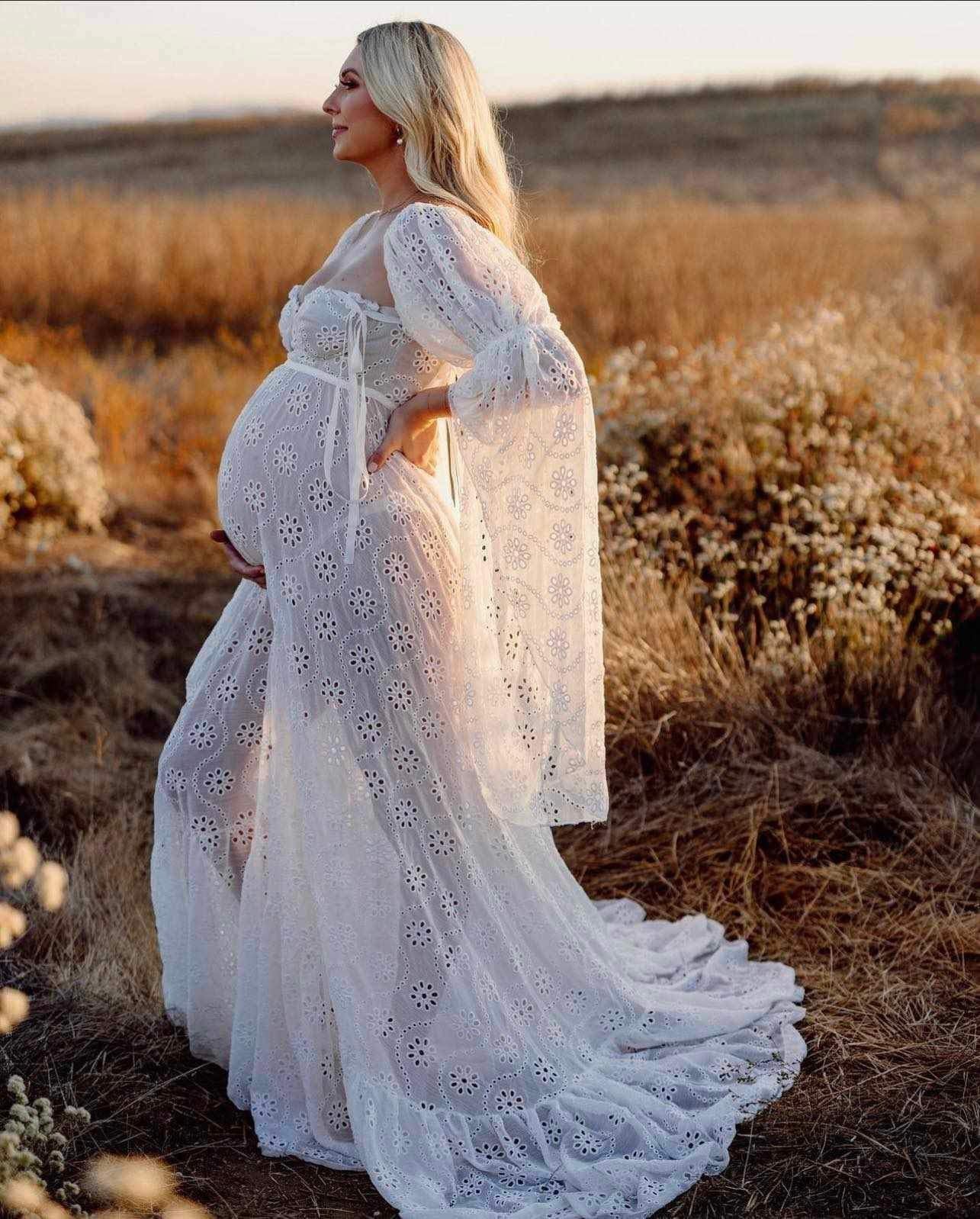 Glowing pregnant lady wearing Everything Lace Hire Gwendolyn maternity dress for her maternity photoshoot