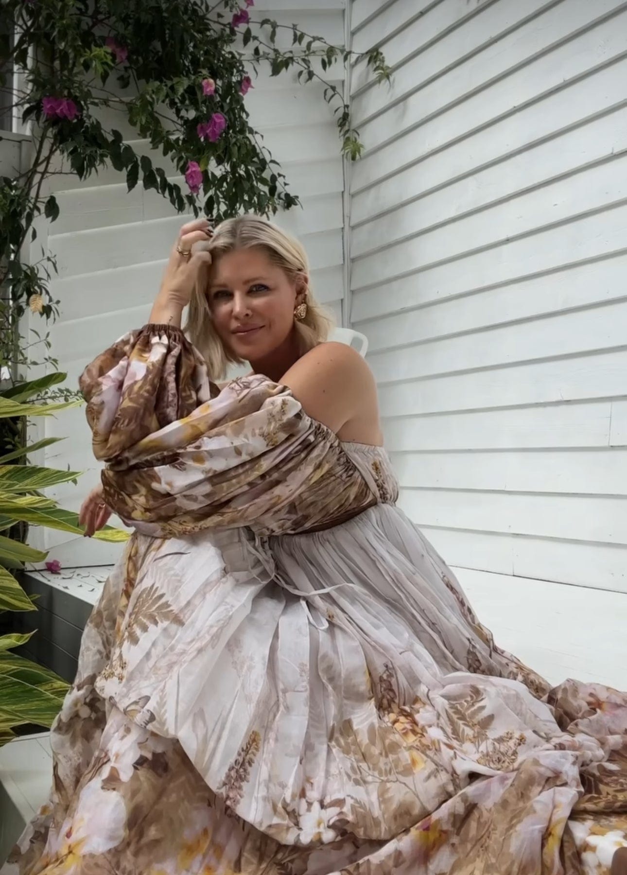 Lady sitting on the step wearing Everything Lace Hire Rooh Collective Bronte Botanica Dress