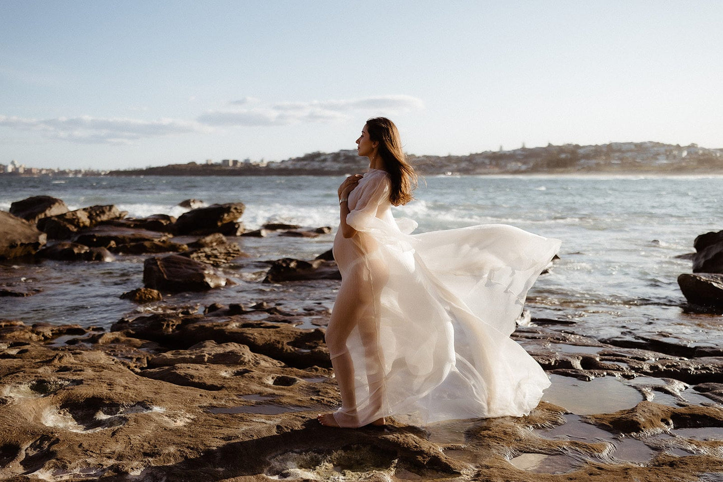 Side view of the Vienna Maternity Photoshoot Dress from Everything Lace Hire showing it's long train and etheral flow for maternity photoshoots