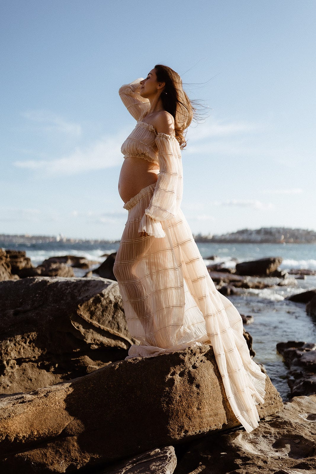Pregnant woman wearing Everything Lace Hire Wonderful Moments Maternity Photoshoot Set at golden hour